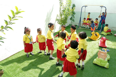 Kids having fun in the garden at The VIT School Udaipur