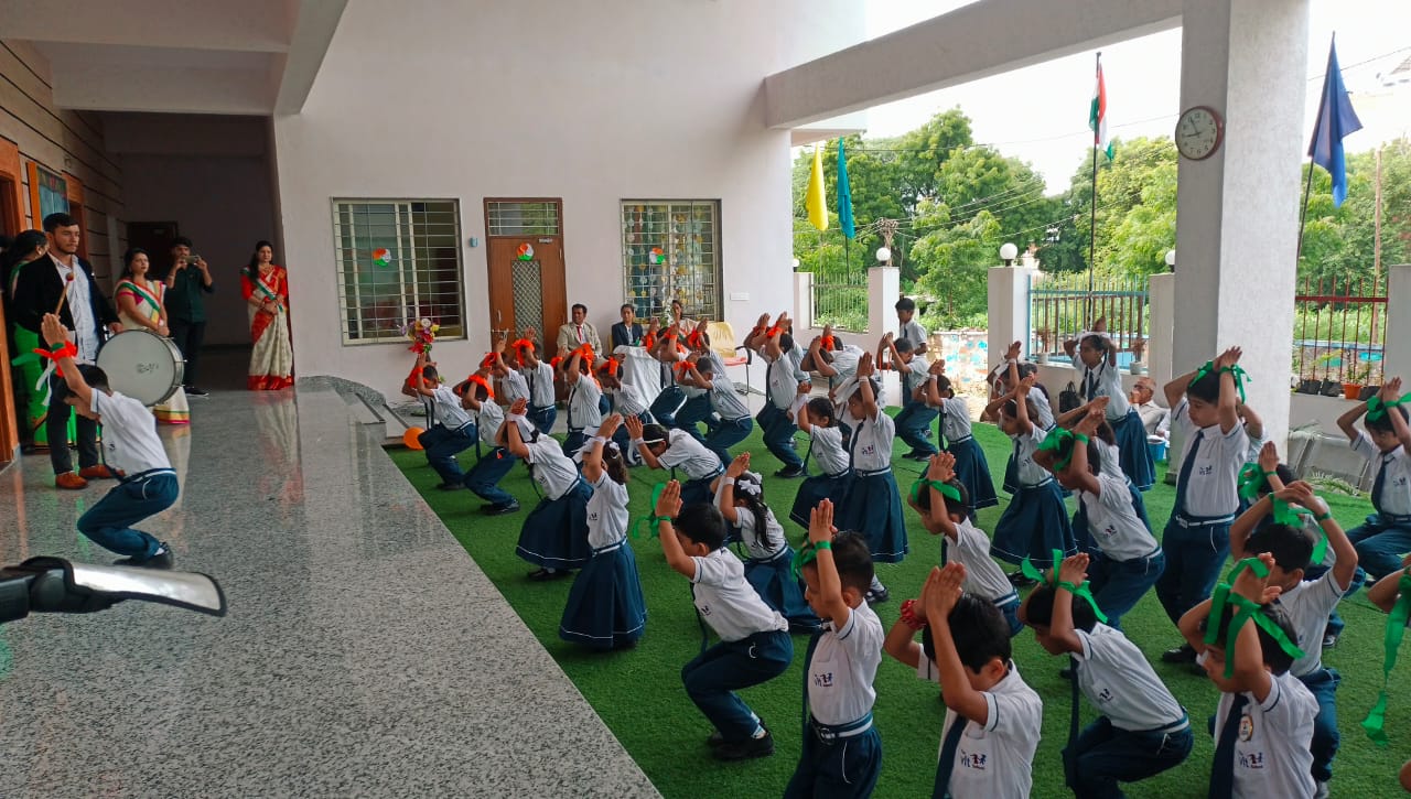 Kids enjoying fun yoga exercises at The VIT School
